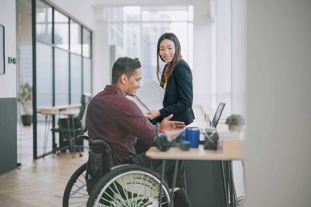 Man and woman talking in an office