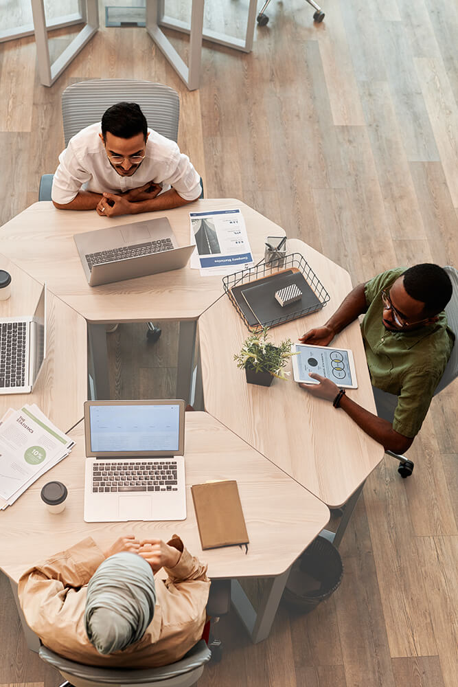 Overhead shot image of colleagues working together in an office