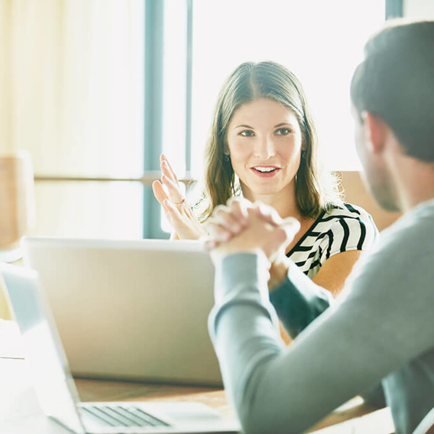 white woman at laptop talking with third party vendor