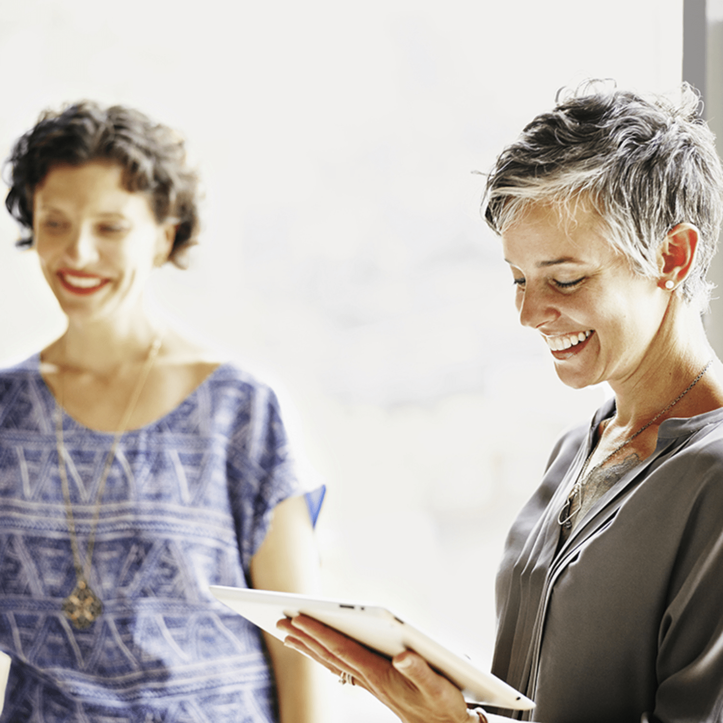 two women happy at workplace